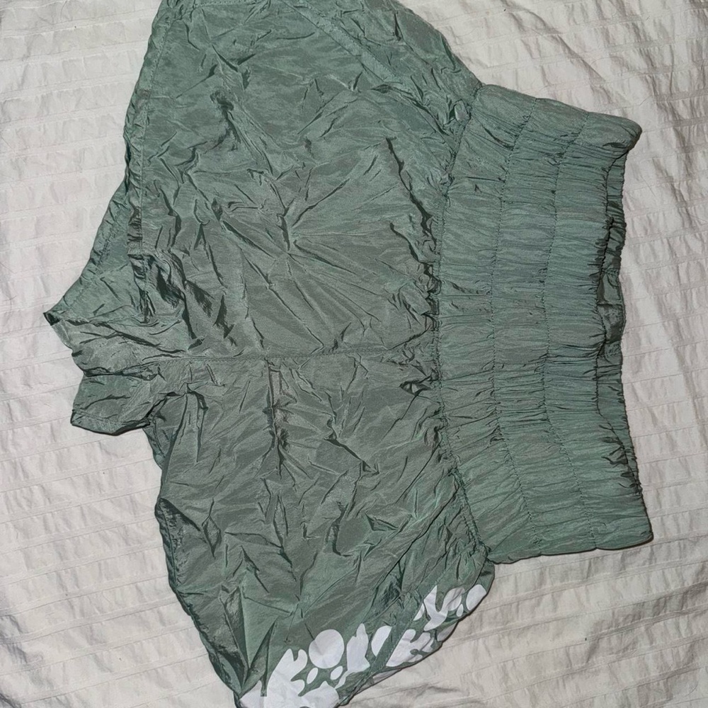Green Scrunchy Workout Shorts with White Floral Detail